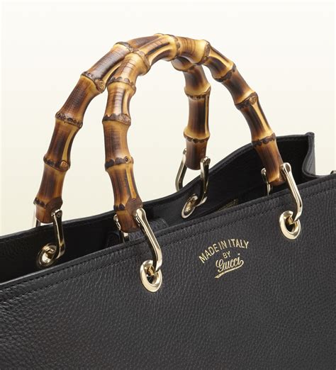 gucci bamboo handle tote|Gucci tote with bamboo tassel.